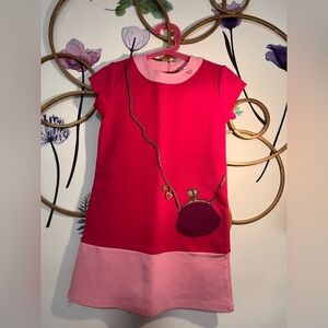 Pink and Fuishia Dress with Purse Design
54% Cotton, 42% polyester, 4% Spandex